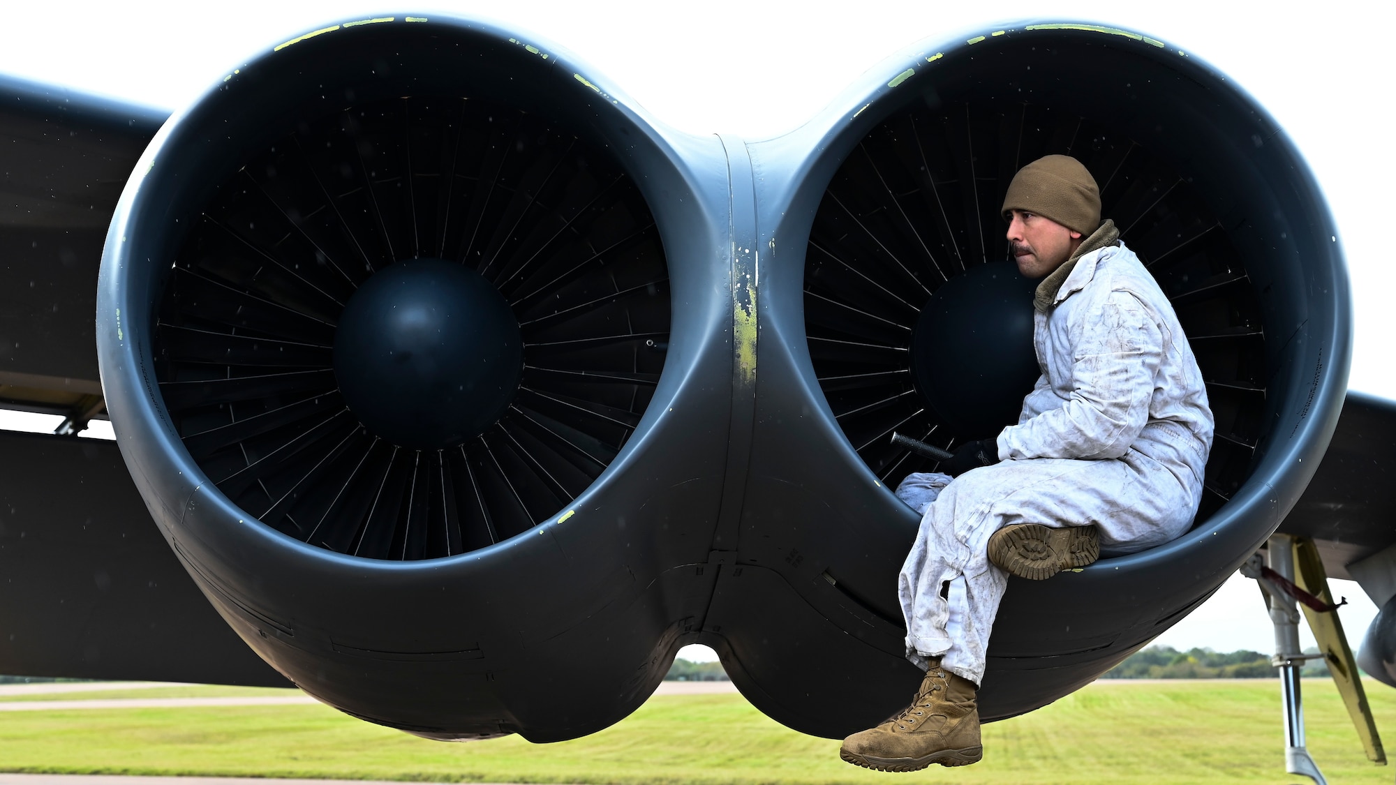 Crew chief inspects the engine of a B-52H Stratofortress