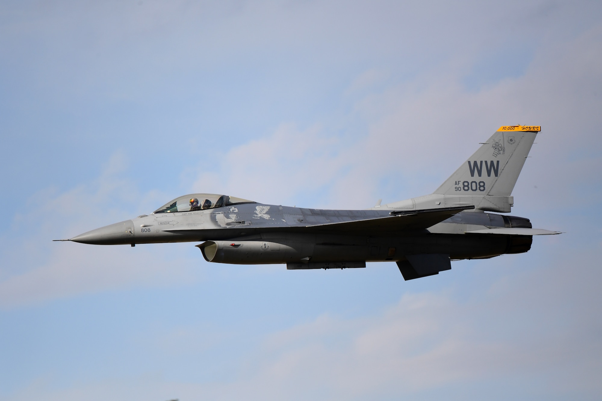 An F-16 Fighting Falcon performs a high-speed pass