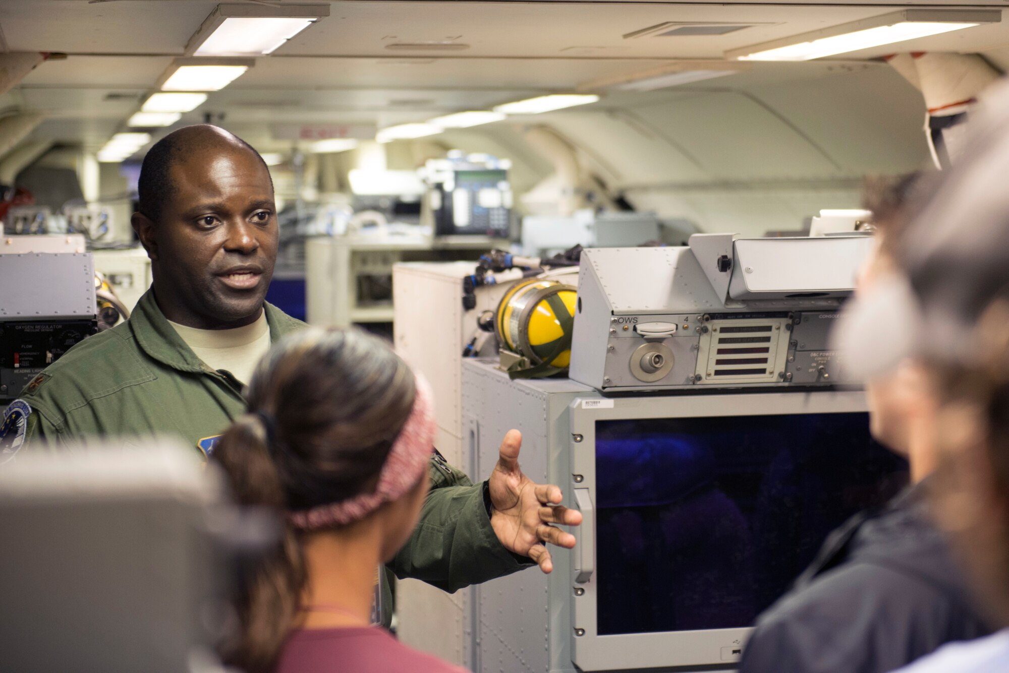 U.S. Air Force Maj. Wendell Noble, the assistant director of operations with the 116th Operations Support Squadron, Georgia Air National Guard, briefs Mercer University upperclassmen on an E-8C Joint STARS at Robins Air Force Base, Ga., Oct. 15, 2019. The students from the computer science department worked on an innovation project to help reform the way JSTARS scheduling is run, and a behind-the-scenes look explained some current operating procedures.