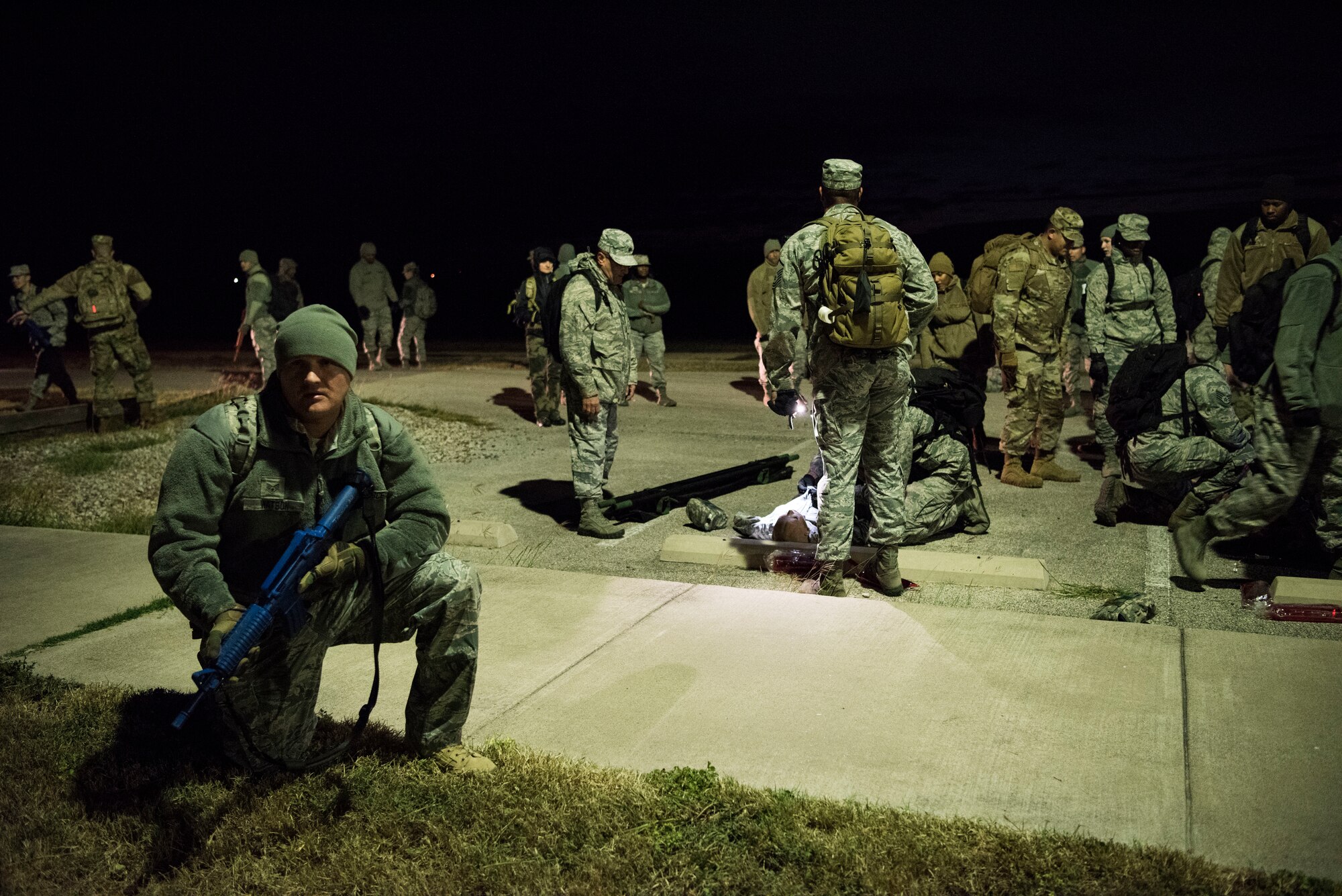Staff Sgt. Matthew Watson, a 47th Operational Medical Readiness Squadron medical technician, guards a unit giving medical care during a readiness exercise at Laughlin Air Force Base, Texas, Oct. 25, 2019. One aspect the team trained on was setting up 360 degree perimeter security to protect anyone giving medical care from adversaries. (U.S. Air Force photo by Senior Airman Marco A. Gomez)