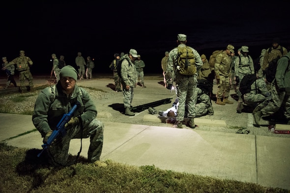 Staff Sgt. Matthew Watson, a 47th Operational Medical Readiness Squadron medical technician, guards a unit giving medical care during a readiness exercise at Laughlin Air Force Base, Texas, Oct. 25, 2019. One aspect the team trained on was setting up 360 degree perimeter security to protect anyone giving medical care from adversaries. (U.S. Air Force photo by Senior Airman Marco A. Gomez)