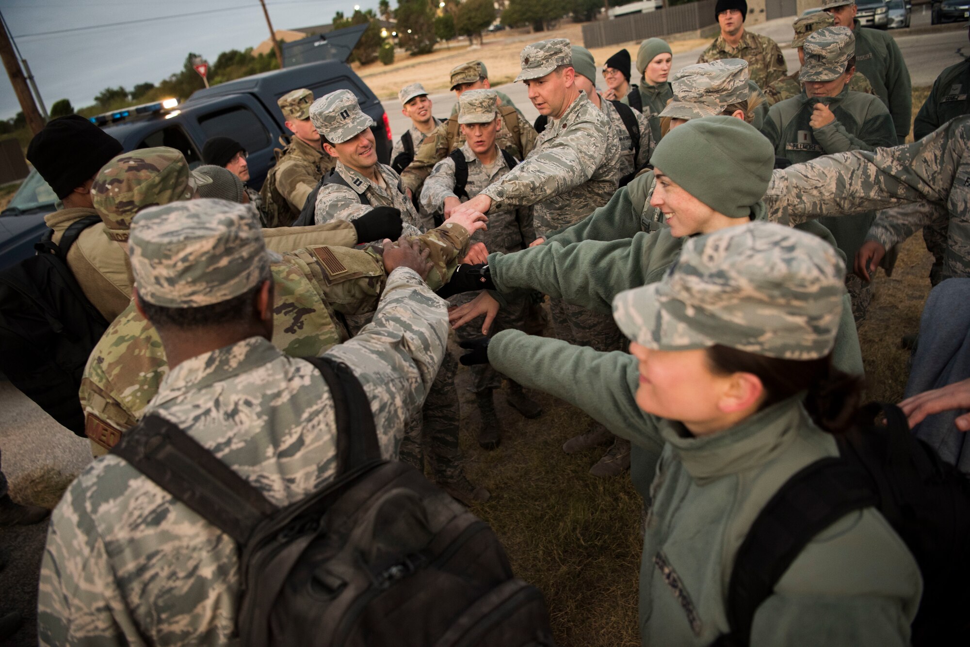 Airmen assigned to the 47th Operational Medical Readiness Squadron gather one last time to celebrate their hard work during a readiness exercise at Laughlin Air Force Base, Texas, Oct. 25, 2019. Communication, command and control were key takeaways from the readiness exercise, said MSgt. Jason Anderson, 47th OMRS NCO in charge of flight medicine. (U.S. Air Force photo by Senior Airman Marco A. Gomez)
