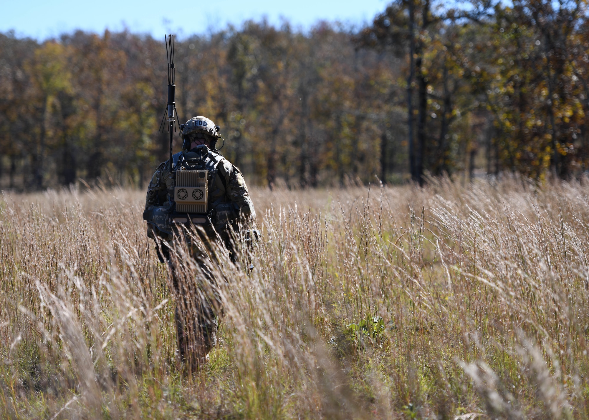 U.S. Air Force Staff Sgt. Htyler Kelley, 19th Civil Engineer Squadron Explosive Ordnance Disposal technician, uses a metal detector to search for simulated improvised explosive devices during a Joint training exercise at Camp Robinson, Arkansas, Oct. 22, 2019.