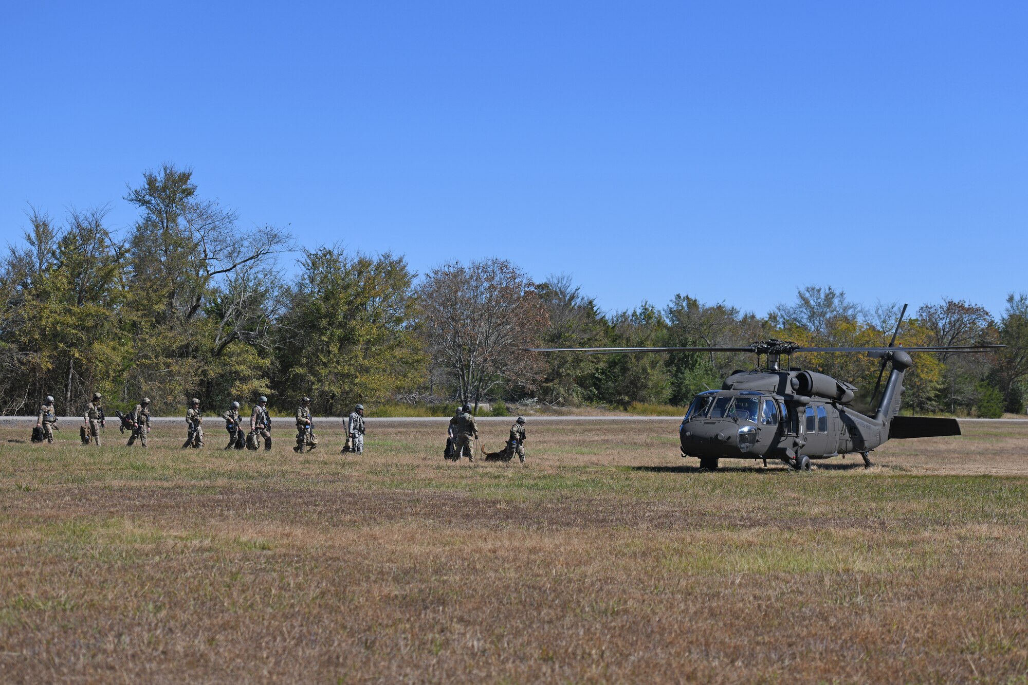 19th Security Forces Squadron defenders and 19th Civil Engineer Squadron Explosive Ordnance Disposal Airmen prepare to board a U.S. Army National Guard UH-60 Black during a Joint training exercise at Little Rock Air Force Base, Arkansas, Oct. 22, 2019.