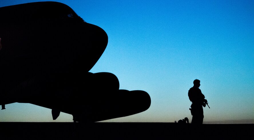 Airman guards a B-52H Stratofortress