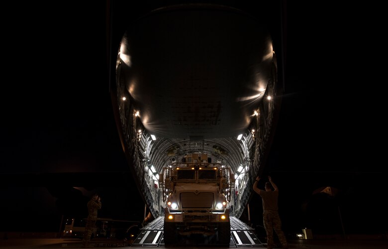 Airmen unload cargo off a C-17 Globemaster III