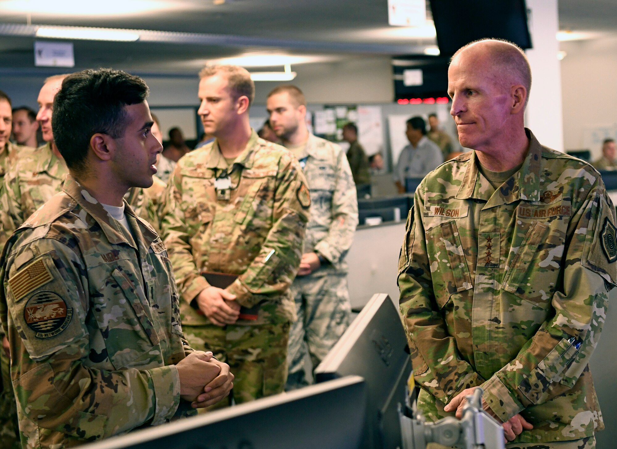First Lt. Partha Naidu, 33rd Network Warfare Squadron officer in charge of innovation, briefs Gen. Stephen Wilson, Vice Chief of Staff of the Air Force, on the 12N12 initiative at Joint Base San Antonio-Lackland, Aug. 28, 2019. The initiative aims to modernize the Air Force Cyberspace Security and Defense mission area to a state-of-the-art system built on simplicity, interoperability, automation and agility. (U.S. Air Force photo by Tech. Sgt. R.J. Biermann)