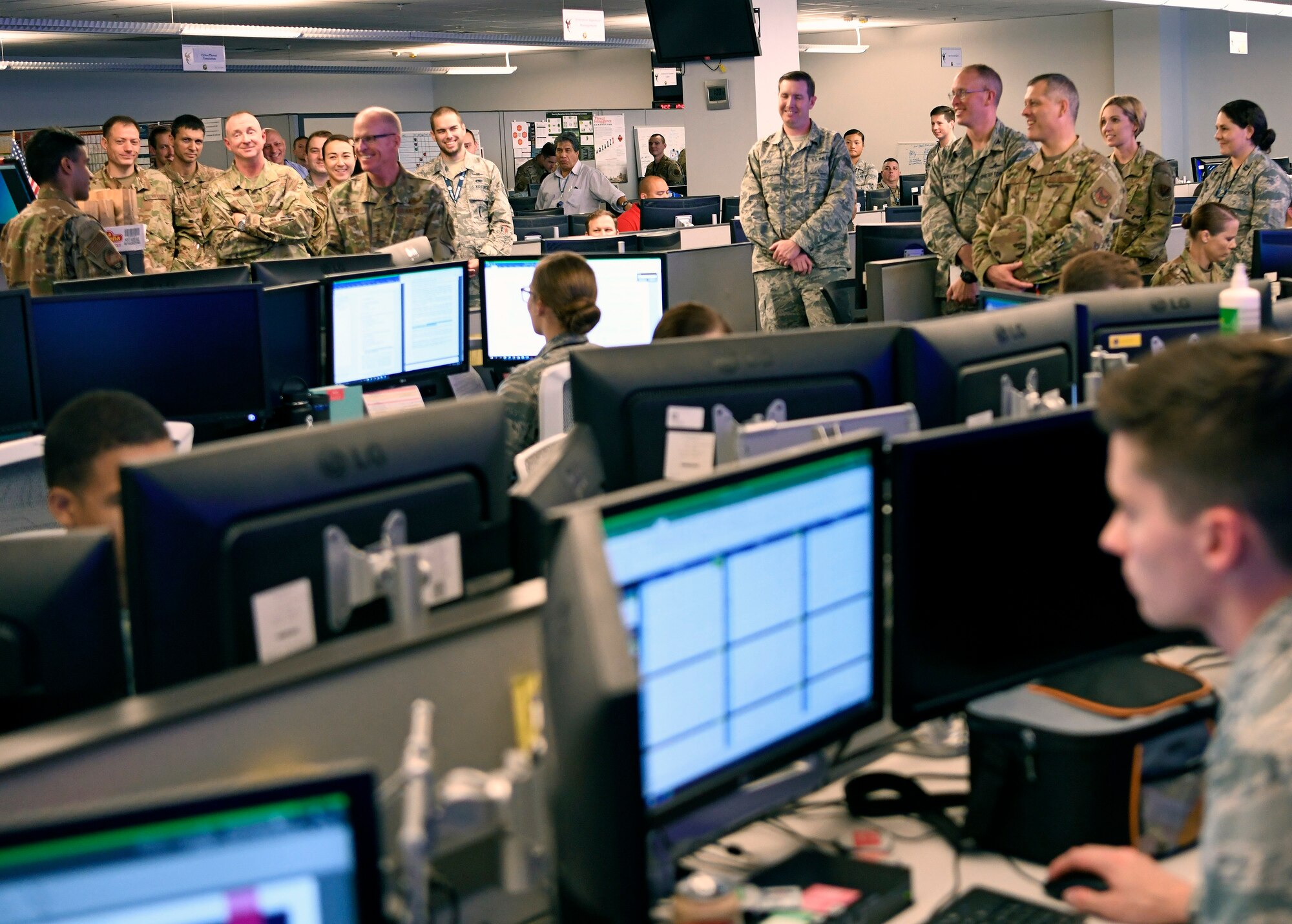 First Lt. Partha Naidu (left), 33rd Network Warfare Squadron officer in charge of innovation, briefs Gen. Stephen Wilson, Vice Chief of Staff of the Air Force, on the 12N12 initiative at Joint Base San Antonio-Lackland, Aug. 28, 2019. The initiative aims to modernize the Air Force Cyberspace Security and Defense mission area to a state-of-the-art system built on simplicity, interoperability, automation and agility. (U.S. Air Force photo by Tech. Sgt. R.J. Biermann)