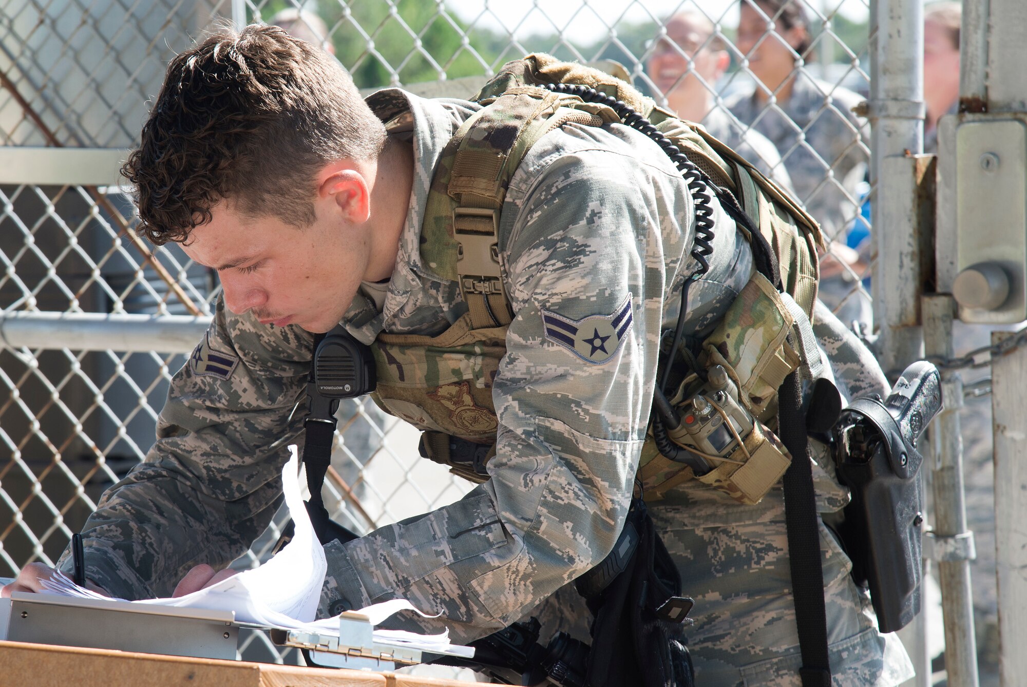 U.S. Air Force Airman 1st Class Fredric Soules, a 6th Security Forces Squadron entry controller, checks a roster during an operational readiness exercise (ORE), Oct. 22, 2019, at MacDill Air Force Base, Fla. The 6th Air Refueling Wing conducted the ORE to ensure proficiency and response times of various units on base during a simulated alert scenario.