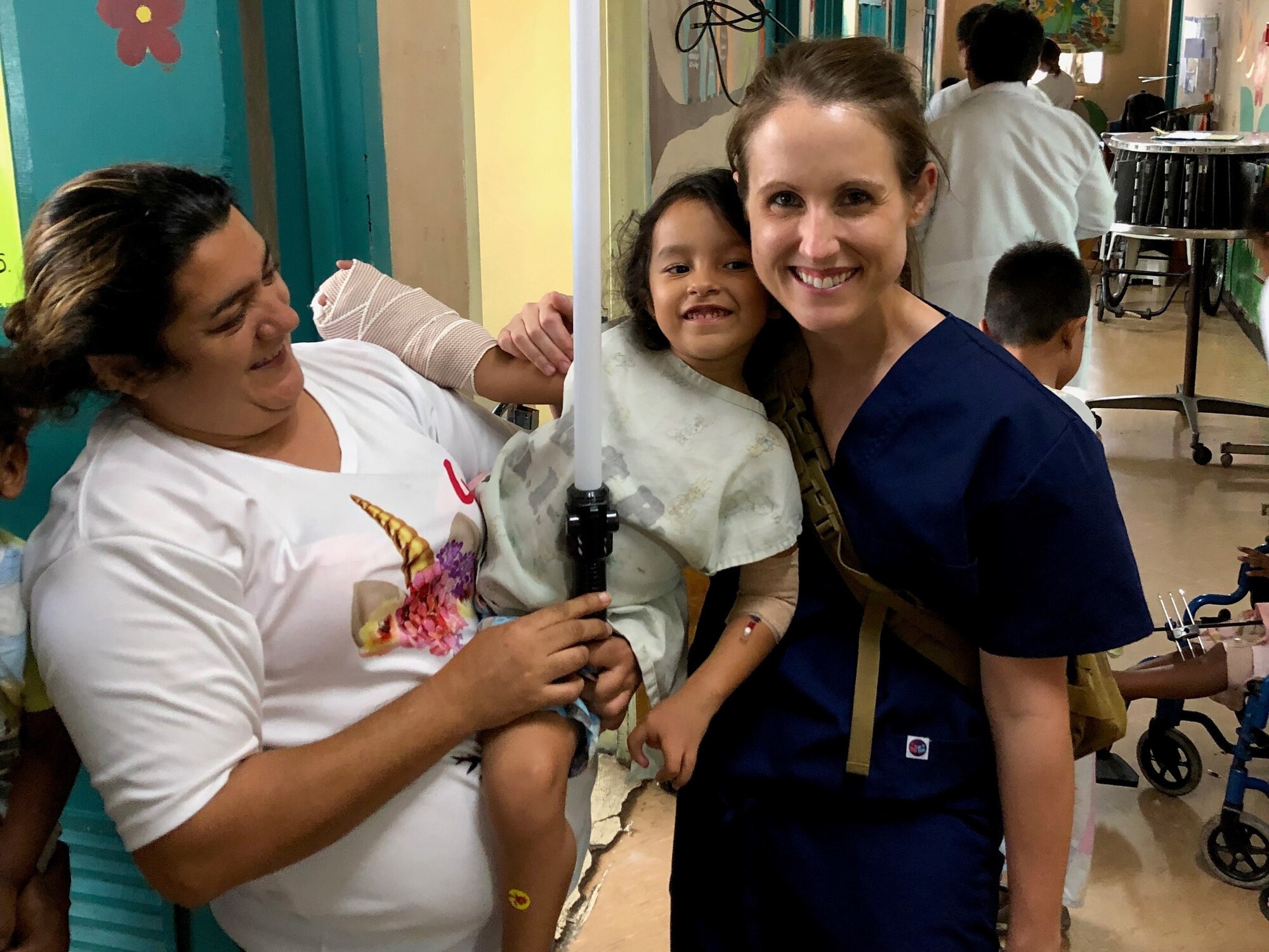 A doctor and a child pose for a picture.