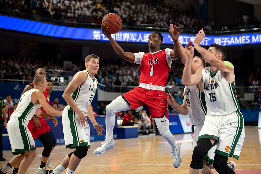 A basketball player prepares to shoot .