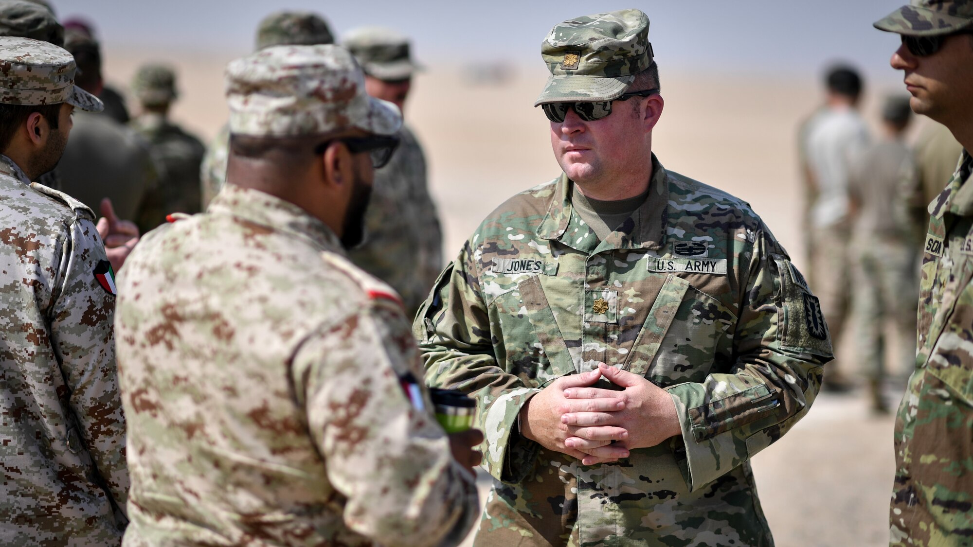 U.S. Army Maj. Darrell Jones, Forensic Exploitation Laboratory Central Command director, meets with Kuwaiti Ministry of Defense EOD technicians before an insensitive munitions disposal training at the Udari Range, Kuwait, Sept. 30, 2019. The training was designed for U.S. and Kuwaiti forces to share techniques, synchronize capabilities and build partnerships.