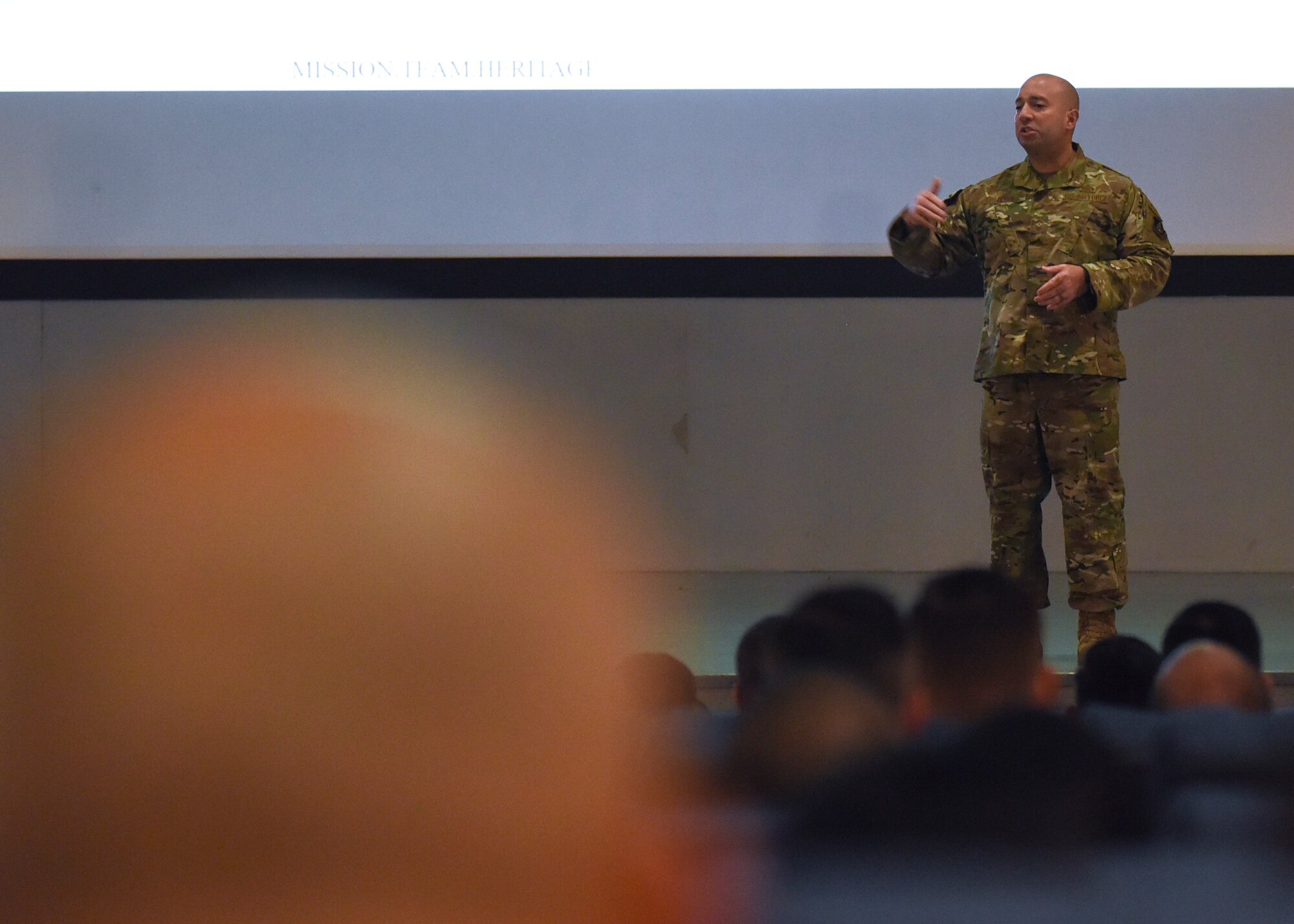 Chief Master Sgt. Steve Cenov, 8th Fighter Wing command chief, speaks to Wolf Pack members about multi-domain operations at Kunsan Air Base, Republic of Korea, Oct. 25, 2019. Multi-domain operations include not only being able to fight on land, in the air and at sea but also in space and cyberspace. (U.S. Air Force photo by Staff Sgt. Anthony Hetlage)