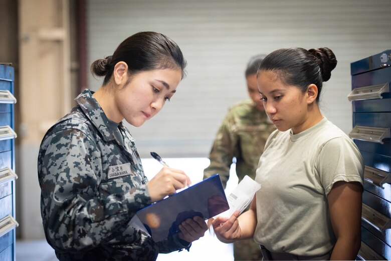 Koku-Jieitai Staff Sgt. Satomi Ogasawara, 3rd Air Depot materiel management assigned with Iruma Air Base, Japan, assists in relocating aircraft parts to a new location, Oct. 21, 2019, at Yokota Air Base, Japan.