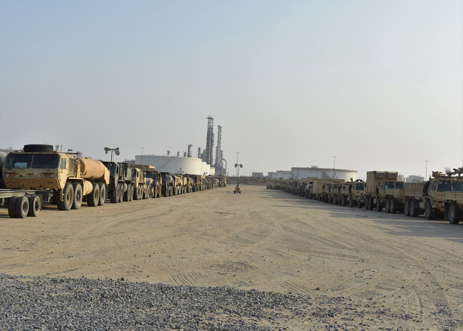U.S. Soldiers in the 30th Armored Brigade Combat Team assist in the line-up and preparation of vehicles for movement to their base in Kuwait after being off-loaded from ships at Shuaiba Port, Kuwait, Oct. 21-25, 2019.  The unit is mobilized to support Operation Spartan Shield and is comprised of units from the North Carolina, South Carolina, Ohio and West Virginia Army National Guard.