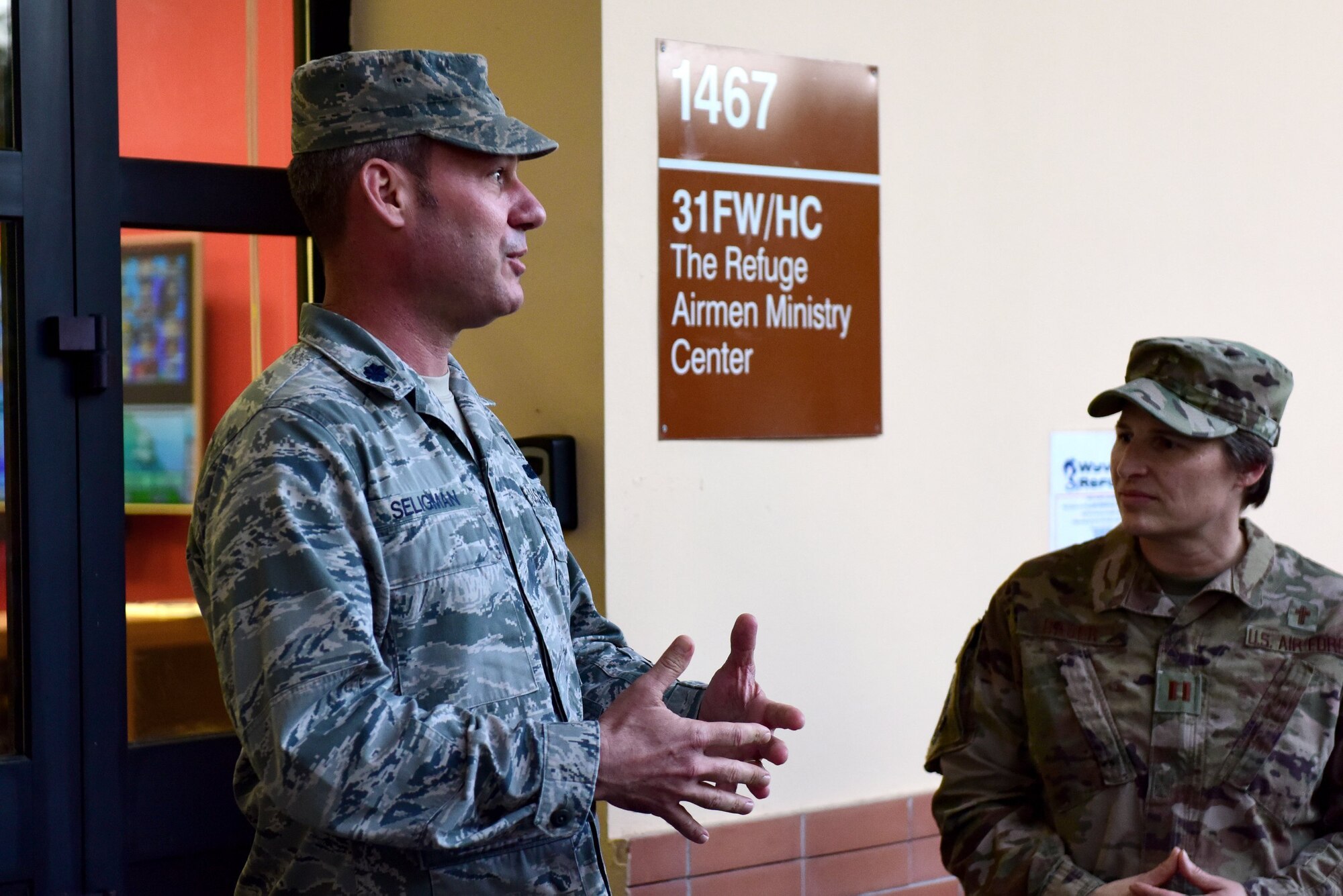 U.S. Air Force Lt. Col. Charles Seligman, 31st Fighter Wing chaplain, addresses attendees at the Wyvern Refuge re-opening ceremony at Aviano Air Base, Italy, Oct. 25, 2019. The Refuge recently went through more than $17,000 worth of renovation, aimed towards offering Airmen E1 through E4 a place to meet and relax on base. (U.S. Air Force photo by Staff Sgt. Kelsey Tucker)