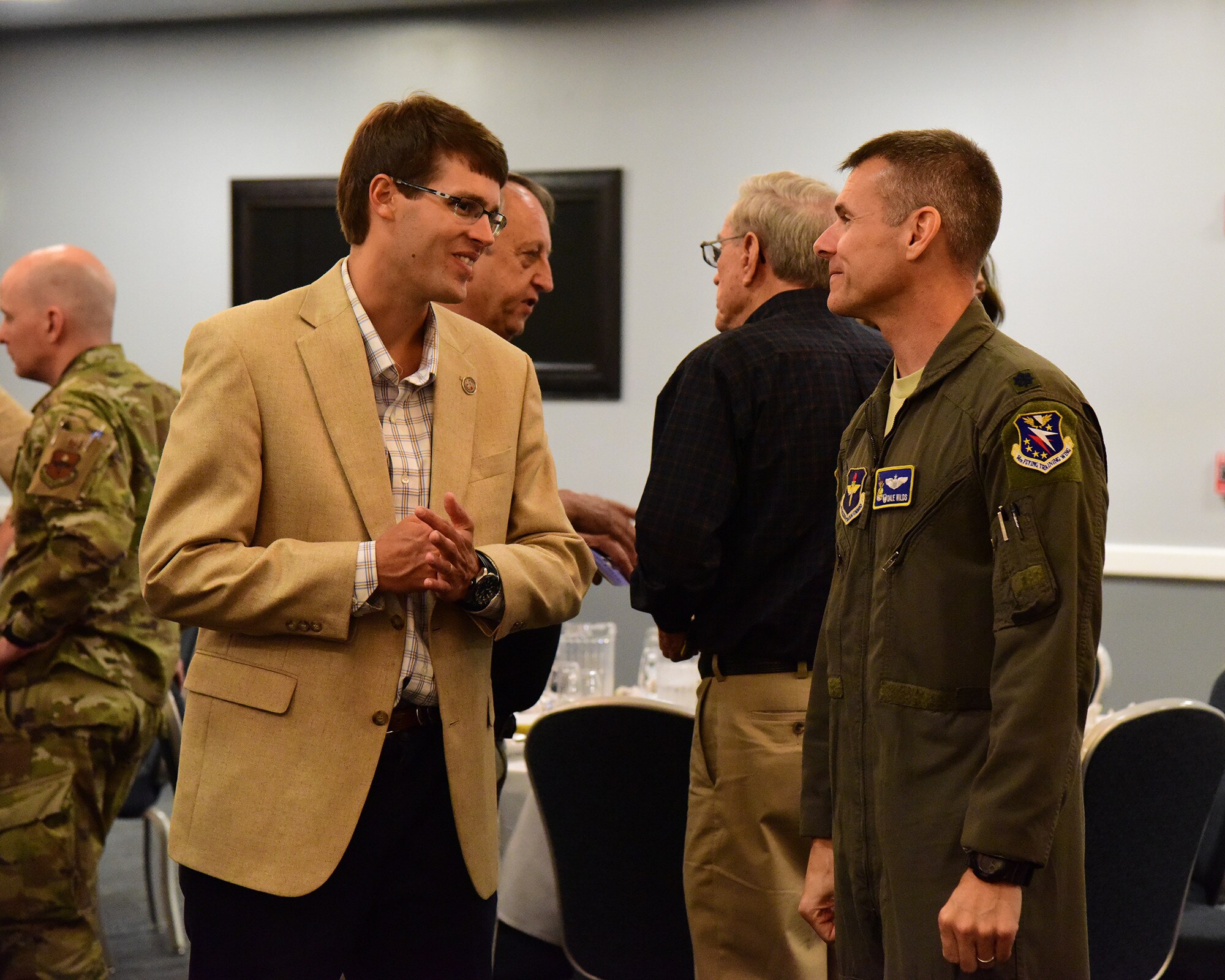 Mr. Greg Alston, field representative for Senator Cindy Hyde-Smith, and Lt Col Nathan Wilds, , 50th Flying Training Squadron commander and guest speaker for the quarterly Base Community Council meeting, talk after lunch Sept. 10, 2019 on Columbus Air Force Base, Miss. (U.S. Air Force photo by Elizabeth Owens)