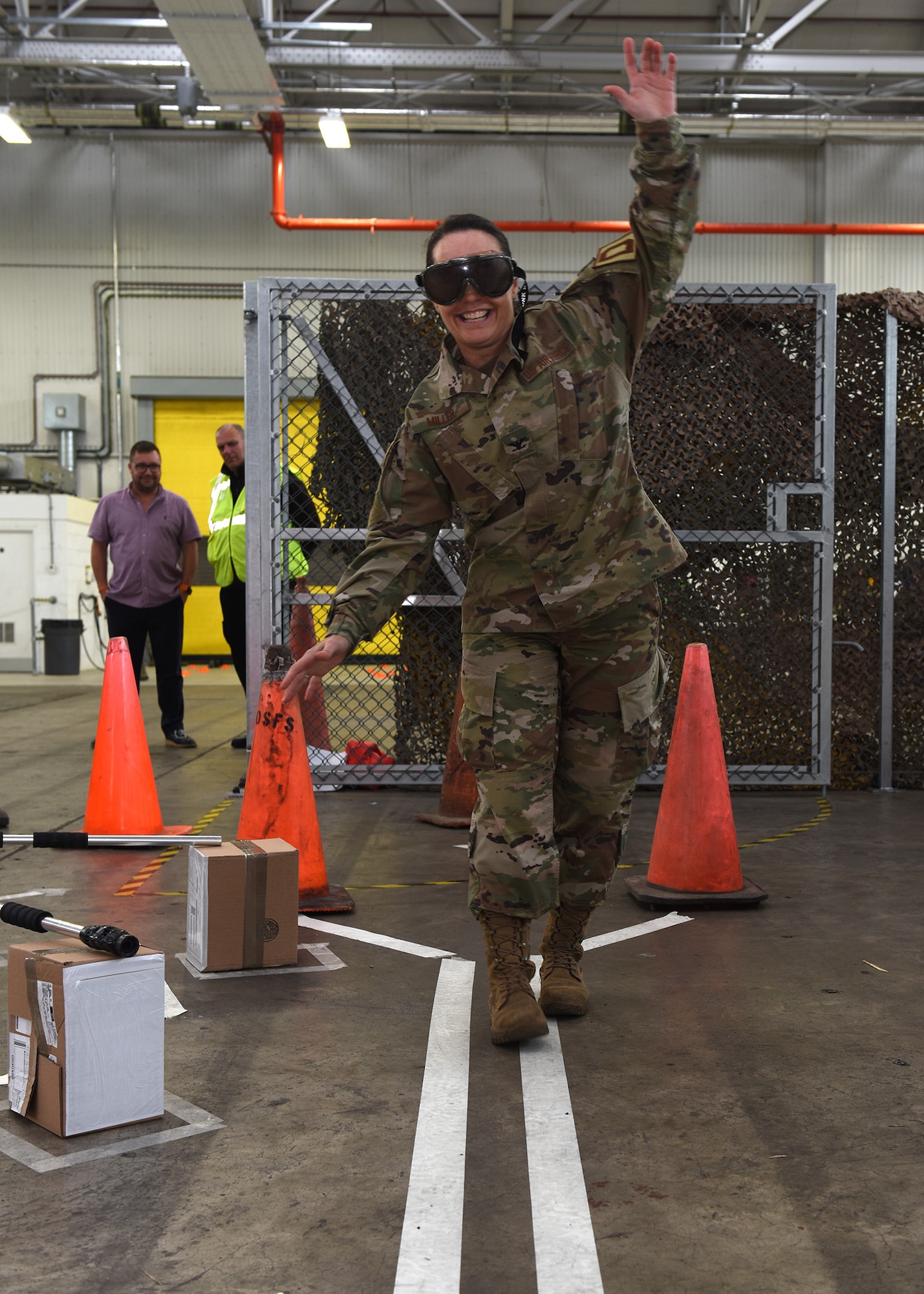 Col. Carol Miller, 100th Mission Support Group commander, wears “drunk goggles” while attempting to walk a straight line at the end of an obstacle course during a 100th Logistics Readiness Squadron safety event at RAF Mildenhall, England, Oct. 11, 2019. Airmen and civilians put together the event which emphasized the dangers or drunk driving and showed the brutal consequences that can happen as a result. The 100th LRS Airmen and civilians worked together to put together an event focusing on the dangers of drunk driving and its consequences. (U.S. Air Force photo by Karen Abeyasekere)