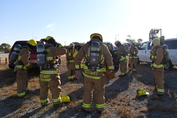 Firefighters from the Wichita Airport Police and Fire Department wait to begin aviation recertification training Oct. 21, 2019, at McConnell Air Force Base, Kan. The team visited McConnell to receive live-fire training for recertification under the Federal Aviation Administration. (U.S. Air Force photo by Airman 1st Class Nilsa E. Garcia)