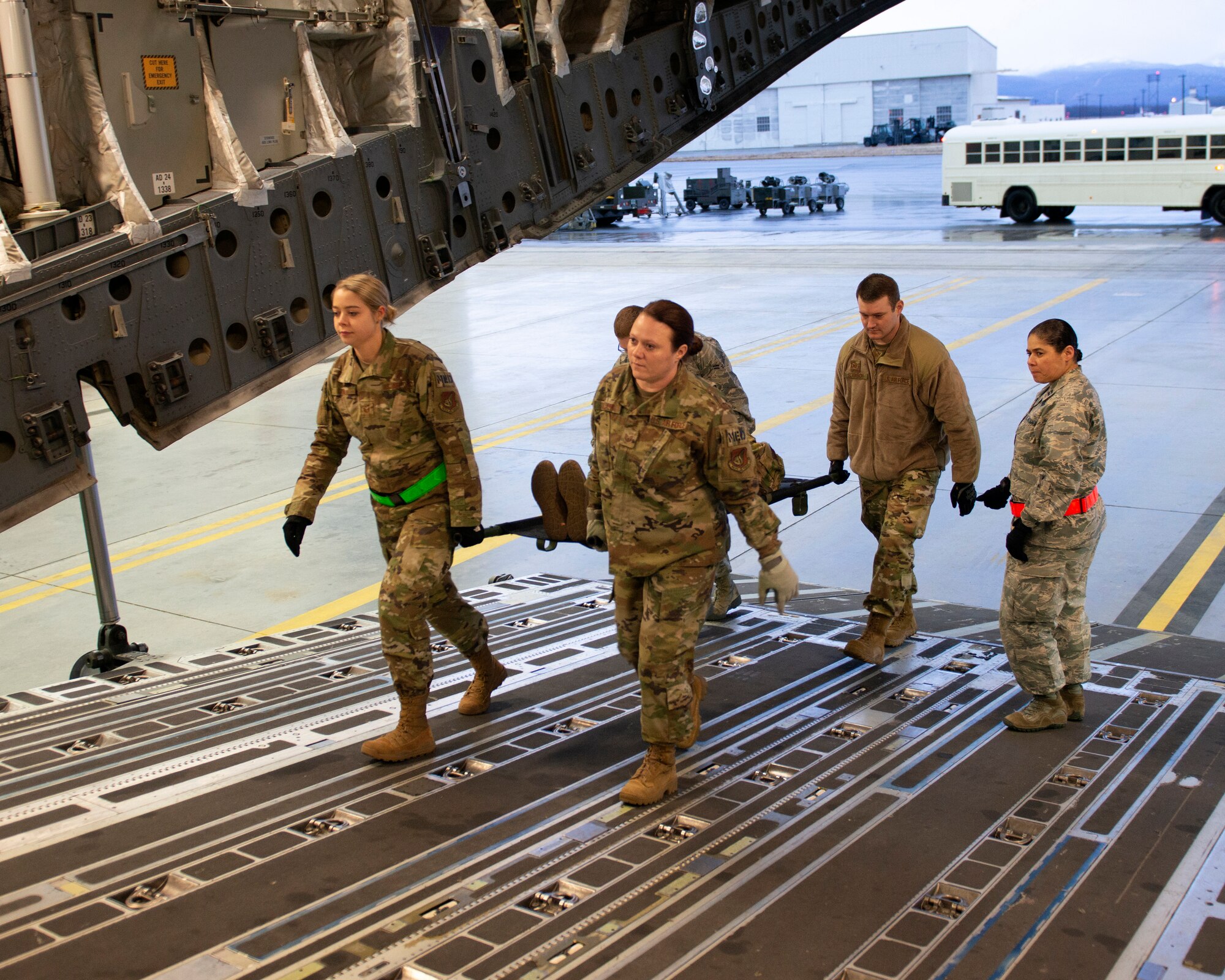 U.S. Airmen with the 673d Medical Group demonstrate loading a patient into a U.S. Air Force C-17 Globemaster III during a 673d Medical Group Provider Open House at Joint Base Elmendorf-Richardson, Alaska, Oct. 24, 2019. The event was held to strengthen partnerships between medical providers on and off of the installation