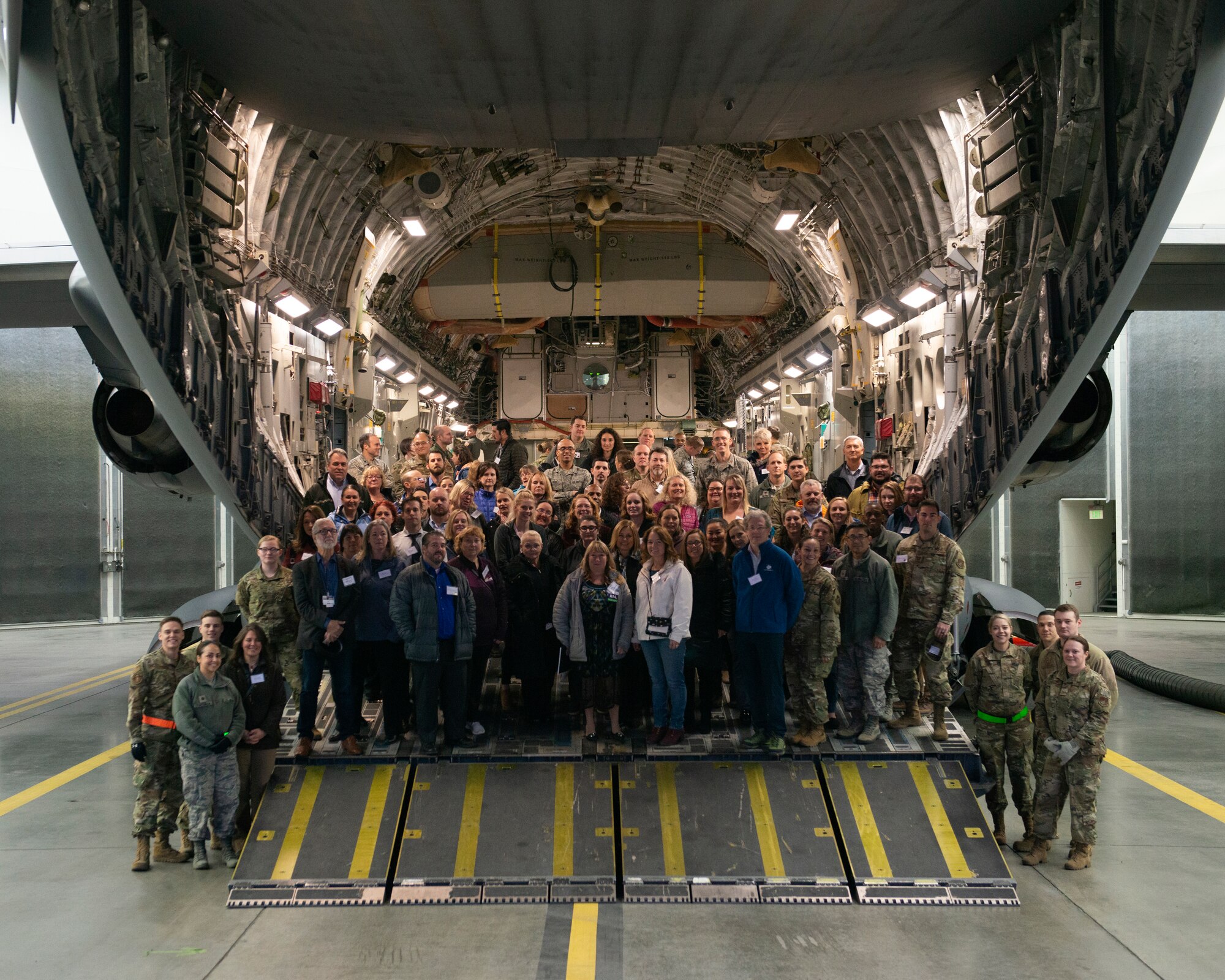 The 673d Medical Group Provider Open House attendees pose for a picture on a U.S. Air Force C-17 Globemaster III at Joint Base Elmendorf-Richardson, Alaska, Oct. 24, 2019. The event was held to strengthen partnerships between medical providers on and off of the installation.