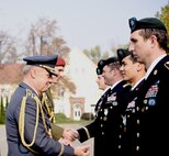Czech Republic Air Force Maj. Gen. Jiri Verner presents the Medal of the Minister of Defense of Czech Republic to Texas Guardsmen assigned to the Army's 19th Special Forces Group (Airborne), during a ceremony in Prostejov, Oct. 25, 2019, hosted by their state partner, Czech Republic. The unique decoration was for supporting the Czech Allies during combat deployment to Afghanistan as part of Operation Resolute Support.