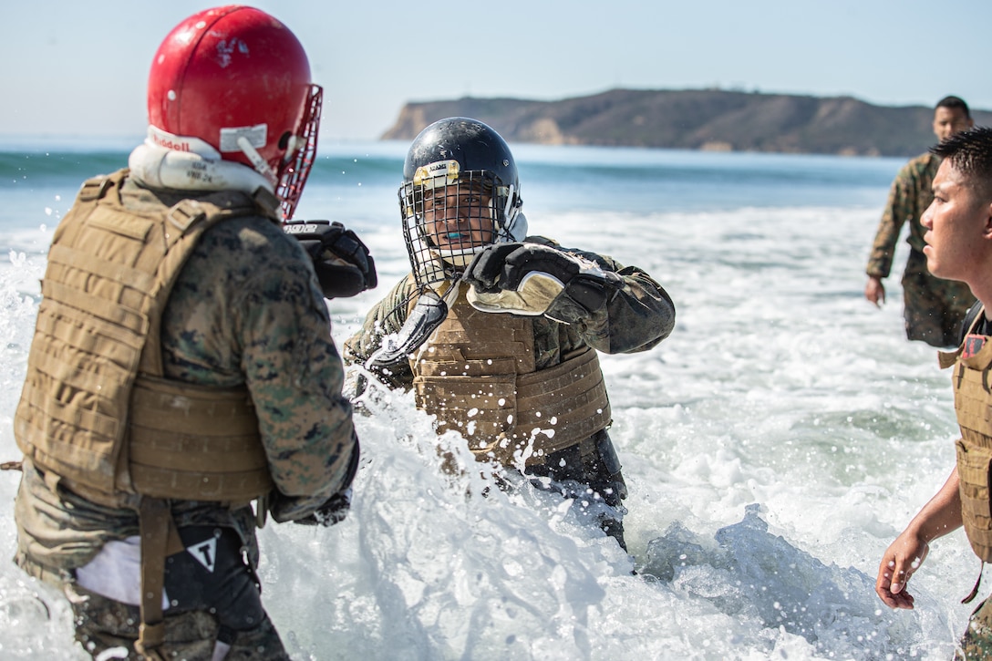U.S. Marines from Marine Corps Air Station Miramar engage in knife combat during the Marine Corps martial arts instructor course 224-19 culminating event at Naval Air Station North Island, Calif., Oct. 24. The three-week MAI course ends with a culminating event aimed to challenge the will and knowledge of every marine in order to earn their tab.