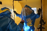U.S. Army Sgt. Brandi Tipton decontaminates U.S. Air Force Staff Sgt. Aaron Foscue during the Pennsylvania National Guard's 3rd Weapons of Mass Destruction Civil Support Team evaluation exercise Oct. 24 at the Steam Town National Historic Park, Scranton, Pennsylvania. The team was evaluated by U.S. Army North on its ability to identify nuclear, radiological, chemical and biological contaminants, advise on response measures and assist with requests for support during notional training scenarios.