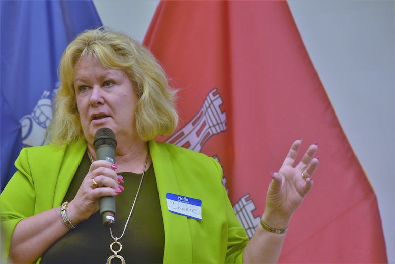 Woman speaks to crowd using microphone