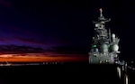 The future USS Tripoli (LHA 7) transits through the Gulf of Mexico in the early morning hours of Oct. 23, 2019 at the beginning of Acceptance Trials.