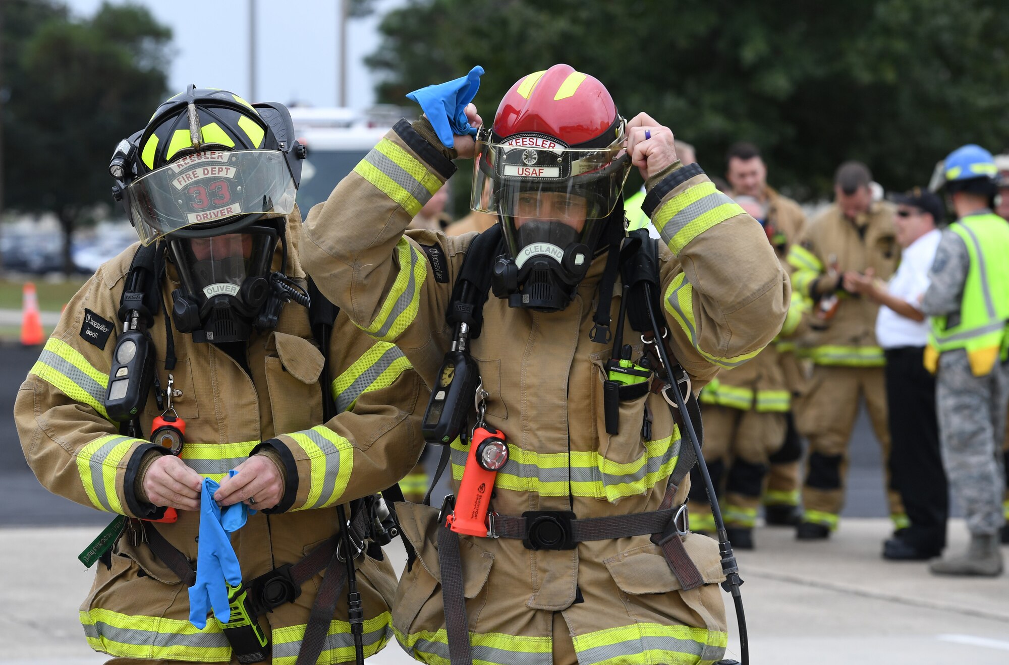 Christopher Oliver and David Cleland, 81st Infrastructure Division firefighters, prepare to make the initial entry into the Live Oak Dining Facility during the Anti-Terrorism, Force Protection Condition and Chemical, Biological, Radiological, Nuclear and high-yield Explosives training exercise at Keesler Air Force Base, Mississippi, Oct. 24, 2019. The exercise scenario simulated a gym bag with ricin found by Keesler personnel who alerted first responders. The exercise was conducted to evaluate the mission readiness and security of Keesler. (U.S. Air Force photo by Kemberly Groue)