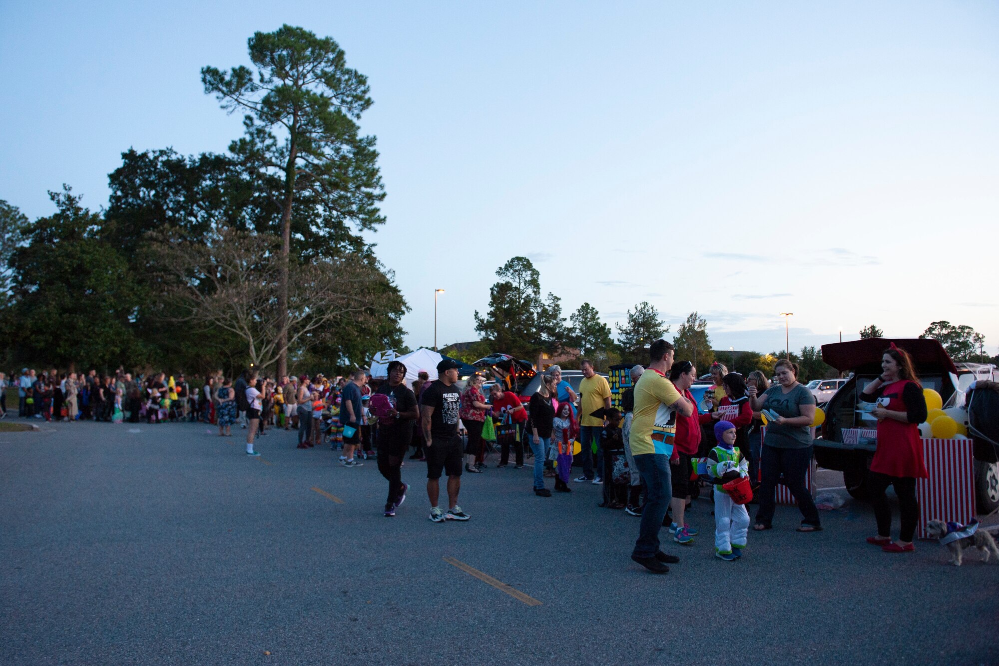 Participants line up for Trunk or Treat Oct. 25, 2019, at Moody Air Force Base, Ga. Participants, dressed in costumes, received candy from volunteers, who decorated their trunks. (U.S. Air Force photo by Airman 1st Class Jasmine M. Barnes)