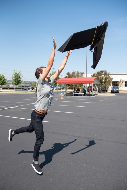 Bethanie Thomas, a civil engineer with Huntsville Center’s Unmanned Aircraft Systems Site Development Branch, launches the senseFly eBee X fixed-wing unmanned aircraft system into the air outside the U.S. Army Engineering and Support Center, Huntsville, Alabama, Oct. 1, 2019.