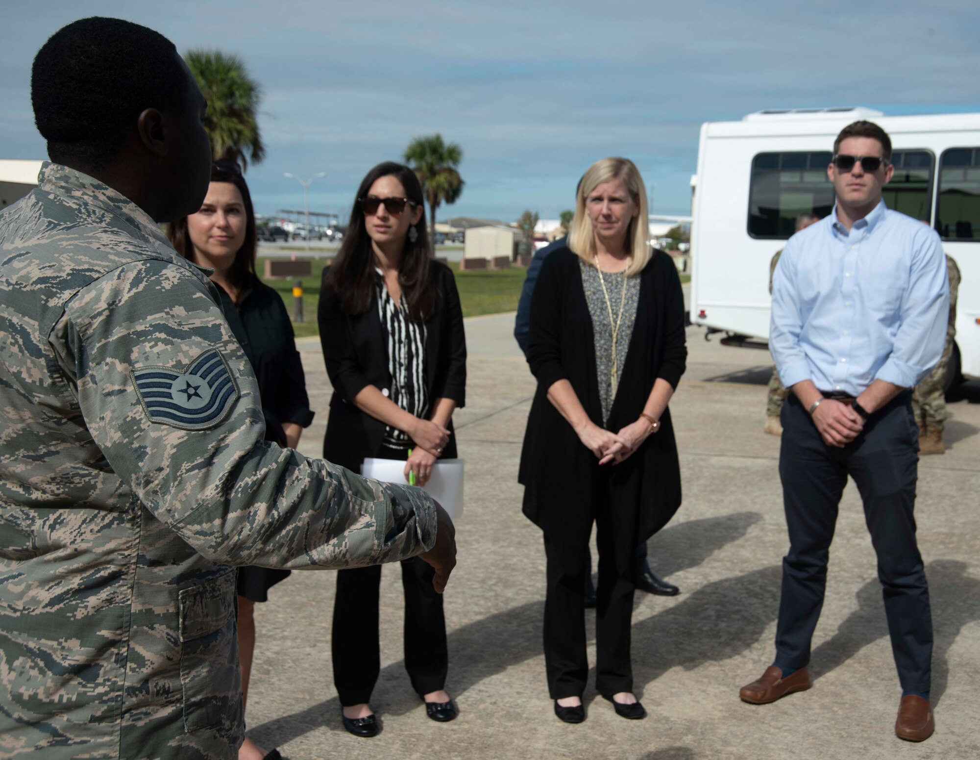 Tech. Sgt. Donte Slocum, 325th Maintenance Squadron F-22 Hangar 4 technician, briefs several members of the Senate Appropriations Committee on Oct. 28, 2019, at Tyndall Air Force Base, Florida. The attendees viewed an aircraft undergoing maintenance and saw one of the few structures to survive Hurricane Michael which devastated the base in 2018. Other than losing its roof, the hangar was completely untouched on the inside, saving the harbored aircraft during the storm. (U.S. Air Force photo by Staff Sgt. Magen M. Reeves)