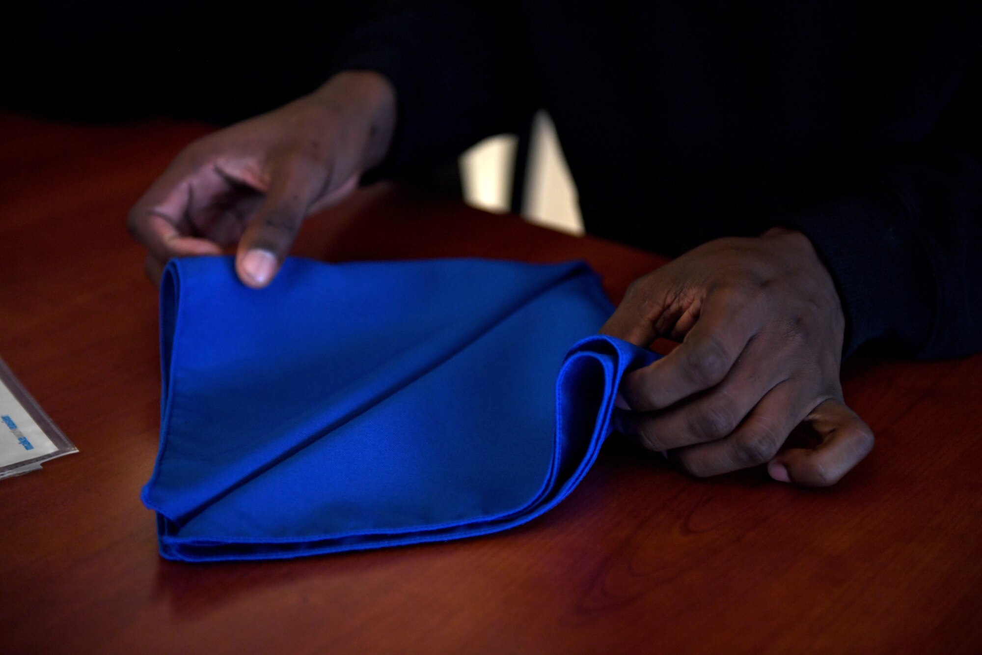 A man holds a napkin.