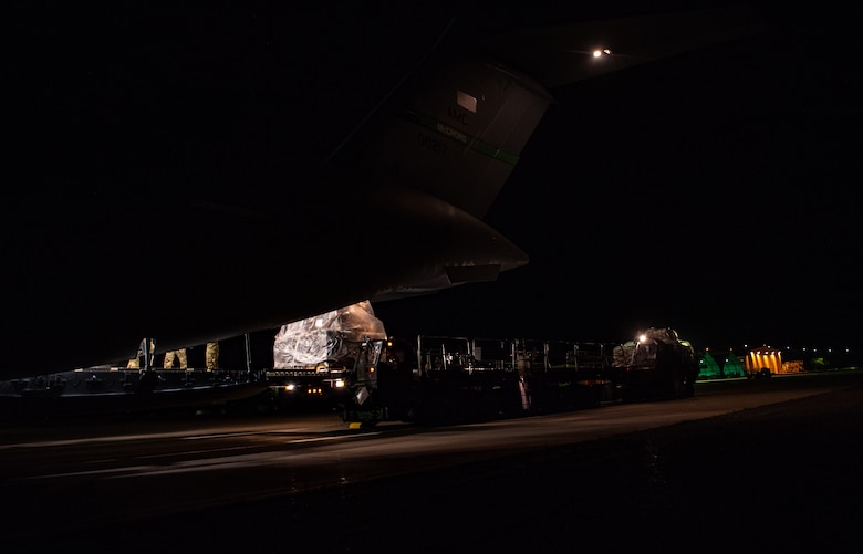 A pallet of rice exits a C-17 Globemaster III assigned to the 62nd Airlift Wing, Joint Base Lewis-McChord, Wash., at Soto Cano Air Base, Honduras, Oct. 24, 2019.  More than 83,000 pounds of rice was donated to the people of Honduras, as 48 percent of the population in rural areas is malnourished, with 35 percent overall. (U.S Air Force photo by Senior Airman Tryphena Mayhugh)