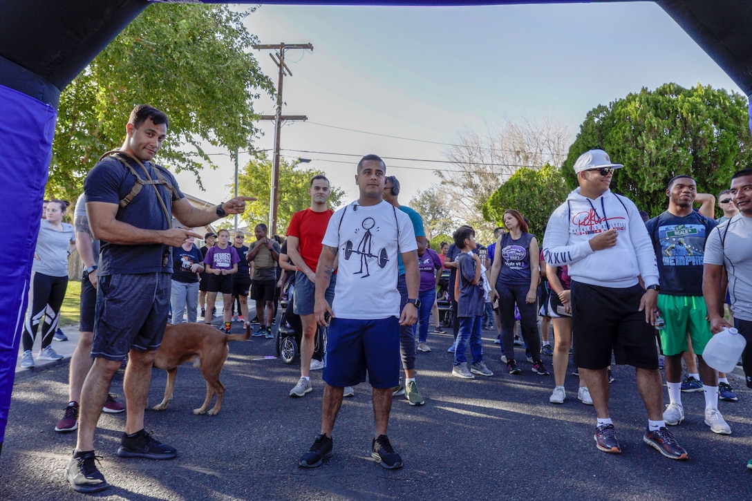 Marines and base patrons are warmed up and ready to start the 6th annual 5K Survivor Walk aboard Marine Corps Logistics Base Barstow, Calif., Oct. 23. (U.S. Marine Corps photo by Jack J. Adamyk)