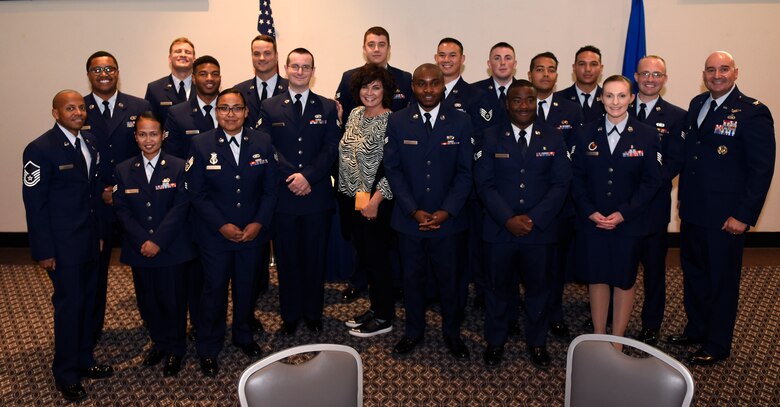 Class 19-G poses for a group photo with their cadre and, the sister of Medal of Honor recipient Capt. Lance P. Sijan, Janine Sijan, at the event center on Goodfellow Air Force Base, Texas, Oct. 24, 2019. Class 19-G told Sijan’s story and held a moment of silence in his honor. (U.S. Air Force photo by Airman 1st Class Ethan Sherwood/Released)