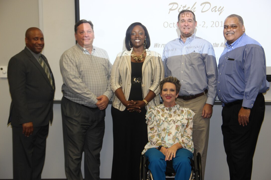 Pictured left to right, Pitch Day Lead Personnel and Panel Members, Artis Clayton, David Sampson, Angela Peterson-Washington, Alexia “Paige” Zukowski,  John Hulsey, and Toy Robinson.  Not pictured: Tanya Lambert (Panel Member). (Courtesy photo)