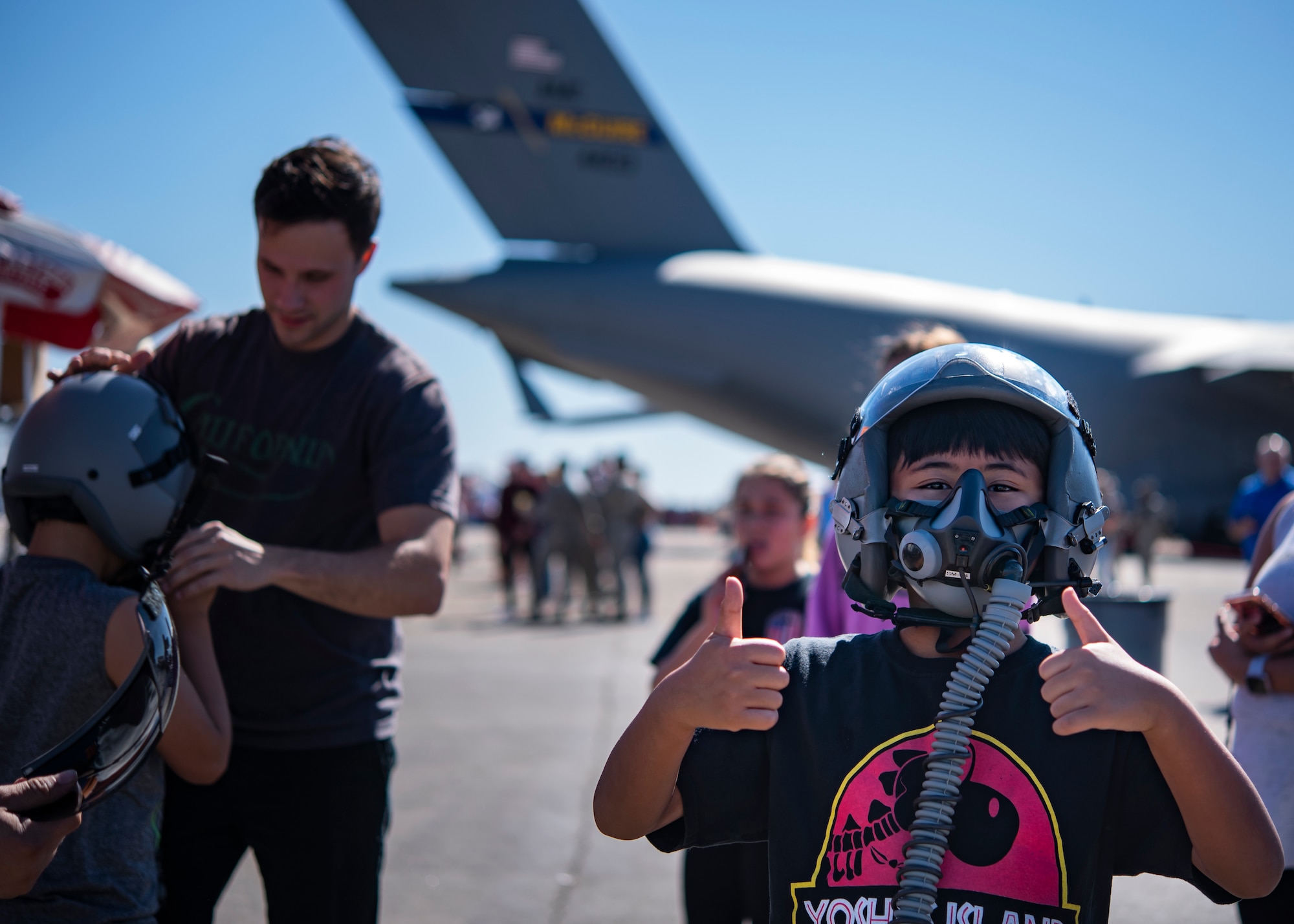 An event goer poses for a picture at the Sheppard Air Force Base Guardians of Freedom Open House and Air Show at Sheppard AFB, Texas, Oct. 27, 2019. The open house and air show is a chance for Sheppard to show and communicate the Air Force's mission as well as Sheppard's specific mission of training, developing and inspiring the next generation of Air Force warriors. (U.S. Air Force photo by Airman 1st Class Pedro Tenorio)
