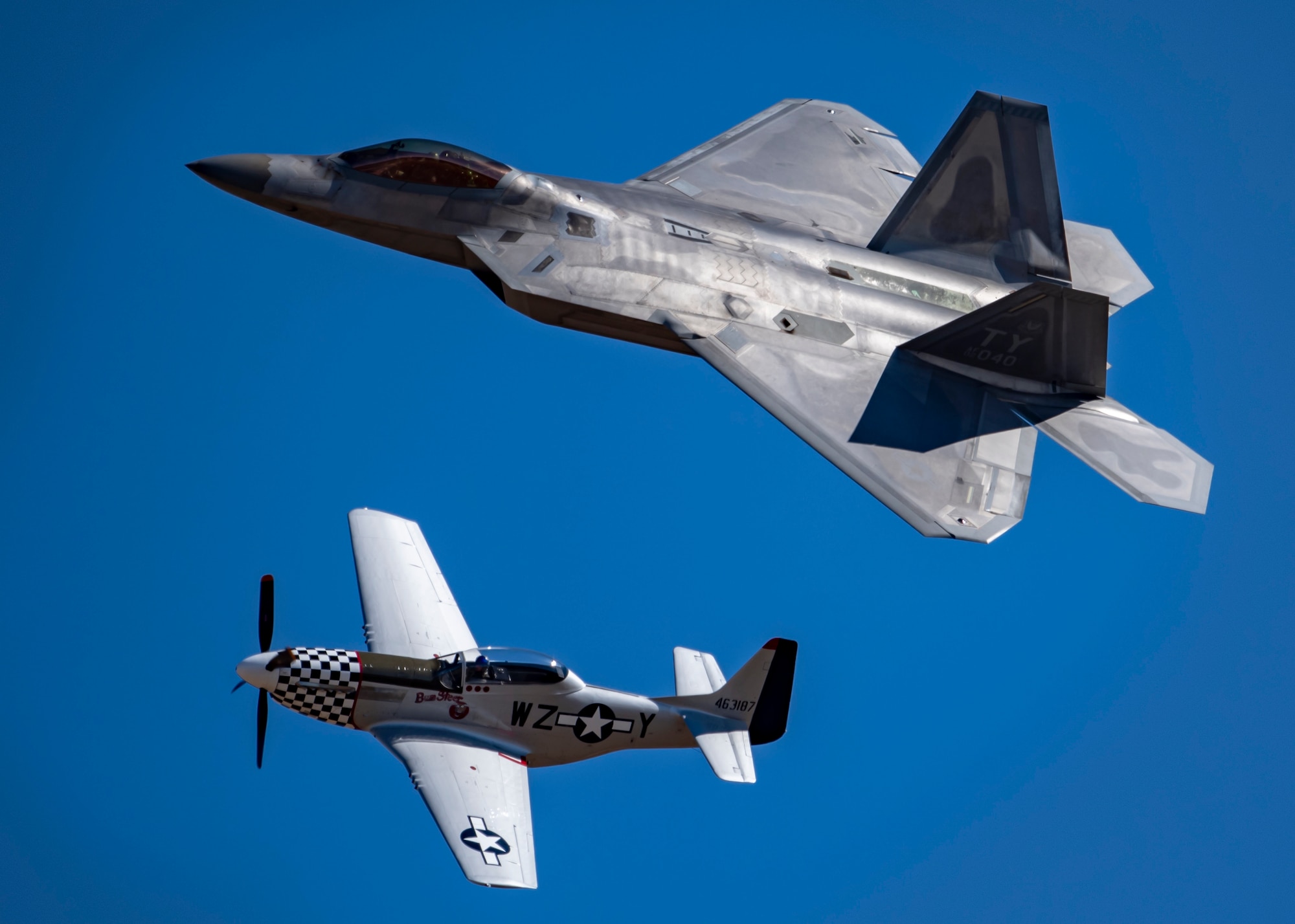 A F-22 Raptor flies alongside a P-51 Mustang during the Sheppard Air Force Base Open House and Air Show at Sheppard AFB, Texas, Oct. 28, 2019. The Air Force Heritage Flight Foundation celebrates U.S. air power history and serves as a living memorial to those who have served in the U.S. Air Force by providing 40-60 annual Heritage Flight demonstrations around the world. (U.S. Air Force photo by Airman 1st Class Pedro Tenorio)