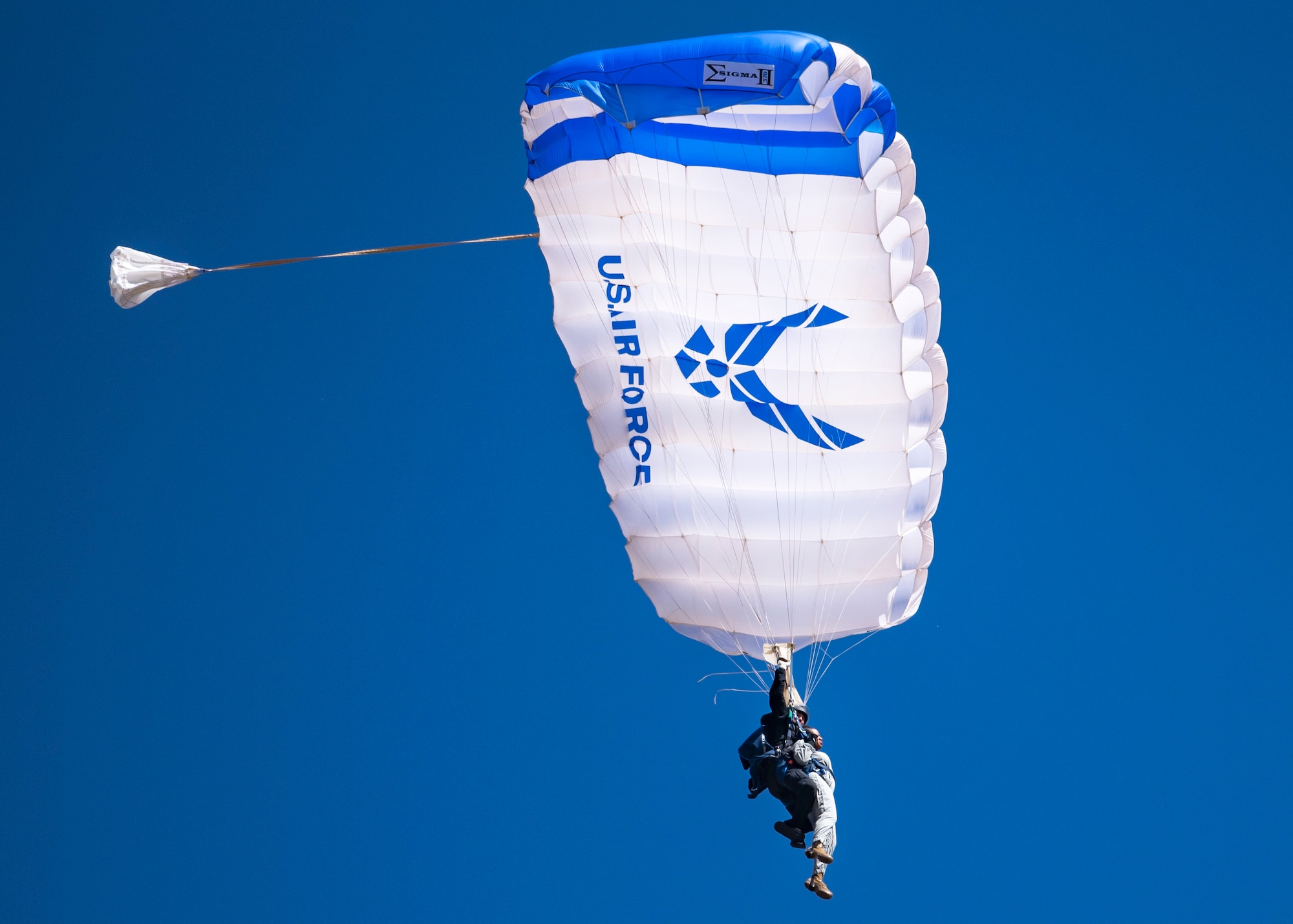 A U.S. Air Force Academy Wings of Blue parachute team member and Chief Master Sgt. Diena Mosely, 82nd Training Wing command chief, glide in a parachute during the Sheppard Air Force Base Guardians of Freedom Open House and Air Show at Sheppard AFB, Texas, Oct. 28, 2019. The Wings of Blue demonstration team travels across the country to air shows, sporting events and other venues to represent the Air Force in precision parachuting. Other than traveling, their primary mission is to run the Air Force's Basic Freefall Parachuting course, known as Airmanship 490. (U.S. Air Force photo by Airman 1st Class Pedro Tenorio)