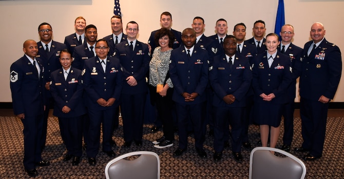 Class 19-G poses for a group photo with their cadre and, the sister of Medal of Honor recipient Capt. Lance P. Sijan, Janine Sijan, at the event center on Goodfellow Air Force Base, Texas, Oct. 24, 2019. Class 19-G told Sijan’s story and held a moment of silence in his honor. (U.S. Air Force photo by Airman 1st Class Ethan Sherwood/Released)
