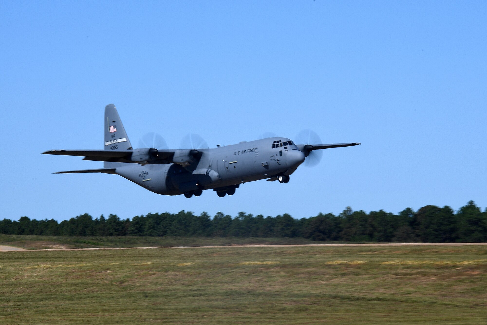 A U.S. Air Force C-130 Hercules aircraft from Little Rock Air Force Base, Arkansas, departs Geronimo Landing Zone during a mission in support of exercise Green Flag Little Rock, Oct. 23, 2019, Fort Polk, Louisiana. The primary objective of the exercise is to support the Joint Readiness Training Center and provide the maximum number of airlift crews, mission planners and ground support elements to a simulated combat environment with emphasis on joint force integration. (U.S. Air Force photo by Tech. Sgt. Liliana Moreno)