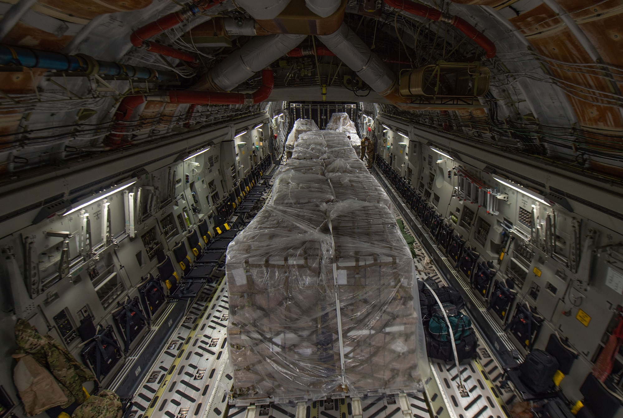 Pallets containing more than 83,000 pounds of rice sit inside a C-17 Globemaster III assigned to the 62nd Airlift Wing, Joint Base Lewis-McChord, Wash., at Altus Air Force Base, Okla., Oct. 24, 2019. The rice was delivered to Honduras during a humanitarian mission to provide food for orphanages, schools and feeding programs for children and families. (U.S Air Force photo by Senior Airman Tryphena Mayhugh)