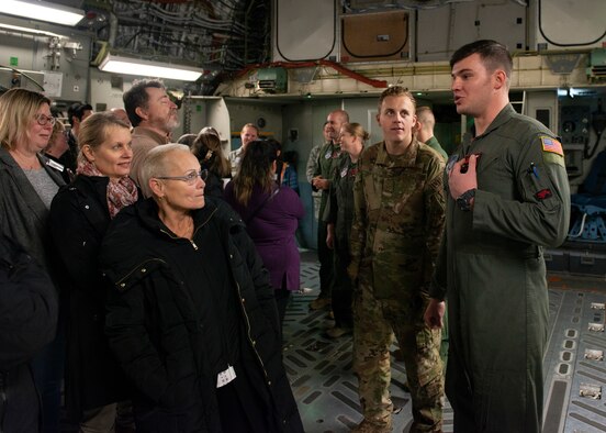 U.S. Air Force Staff Sgt. Mark Wishall, a 517th Airlift Squadron loadmaster, describes his job to medical providers during a 673d Medical Group Provider Open House at Joint Base Elmendorf-Richardson, Alaska, Oct. 24, 2019. The event was held to strengthen partnerships between medical providers on and off of the installation.