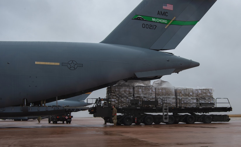 Airmen assigned to the 8th Airlift Squadron (AS), prepare to load pallets of rice onto a C-17 Globemaster III assigned to the 62nd Airlift Wing, Joint Base Lewis-McChord, Wash., at Altus Air Force Base, Okla., Oct. 24, 2019. The rice was delivered to Honduras, which will be used to feed more than 500,000 Honduran men, women and children over the next six weeks. (U.S. Air Force photo by Senior Airman Tryphena Mayhugh)