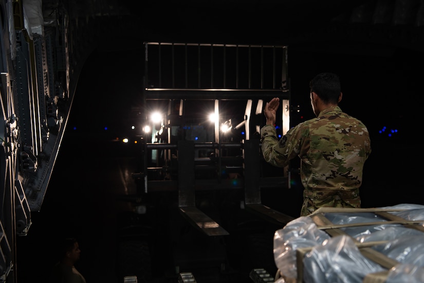 U.S. Air Force Staff Sgt. Marcello Moffat, 8th Airlift Squadron (AS) loadmaster, marshals a forklift toward a C-17 Globemaster III assigned to the 62nd Airlift Wing, Joint Base Lewis-McChord, Wash., at Soto Cano Air Base, Honduras, Oct. 24, 2019. Moffat, along with other 8th AS Airmen, helped deliver more than 83,000 pounds of rice to Honduras during a humanitarian mission. (U.S Air Force photo by Senior Airman Tryphena Mayhugh)