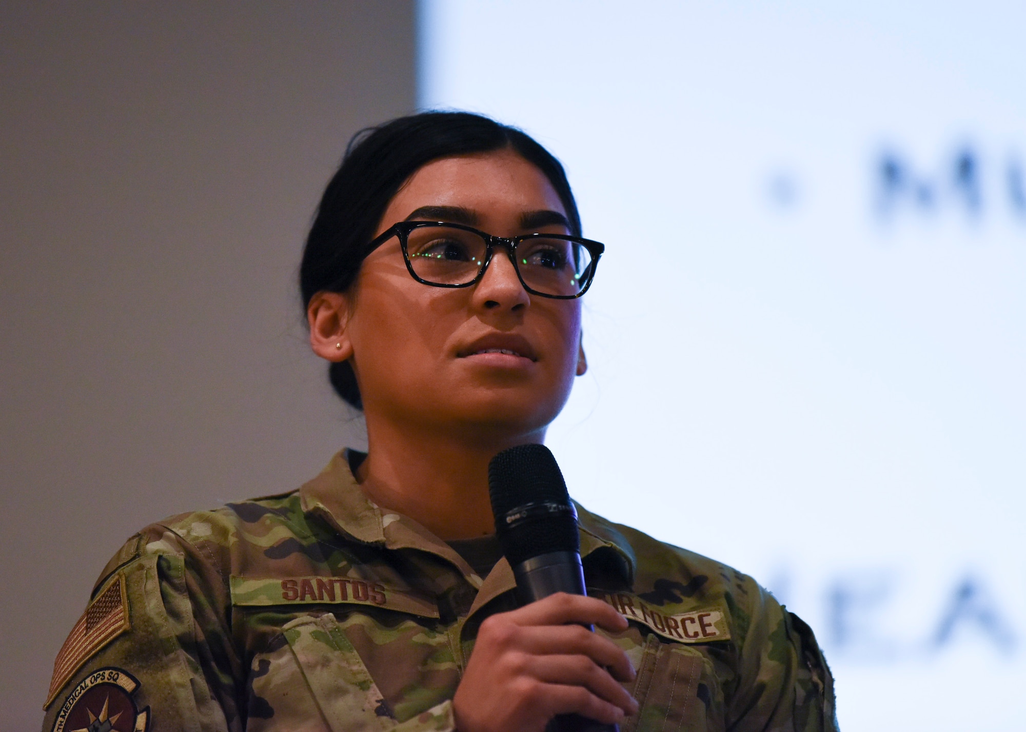 Senior Airman Alondra Santos, 8th Medical Operations Squadron personnel reliability program monitor speaks to Wolf Pack members about her personal experience attending the Air Force Association's 2019 Air, Space and Cyber Conference during a commander’s call at Kunsan Air Base, Republic of Korea, Oct. 25, 2019. Her favorite part of the conference was hearing Chief Master Sgt. of the Air Force Kaleth O. Wright speak about perseverance. (U.S. Air Force photo by Staff Sgt. Anthony Hetlage)