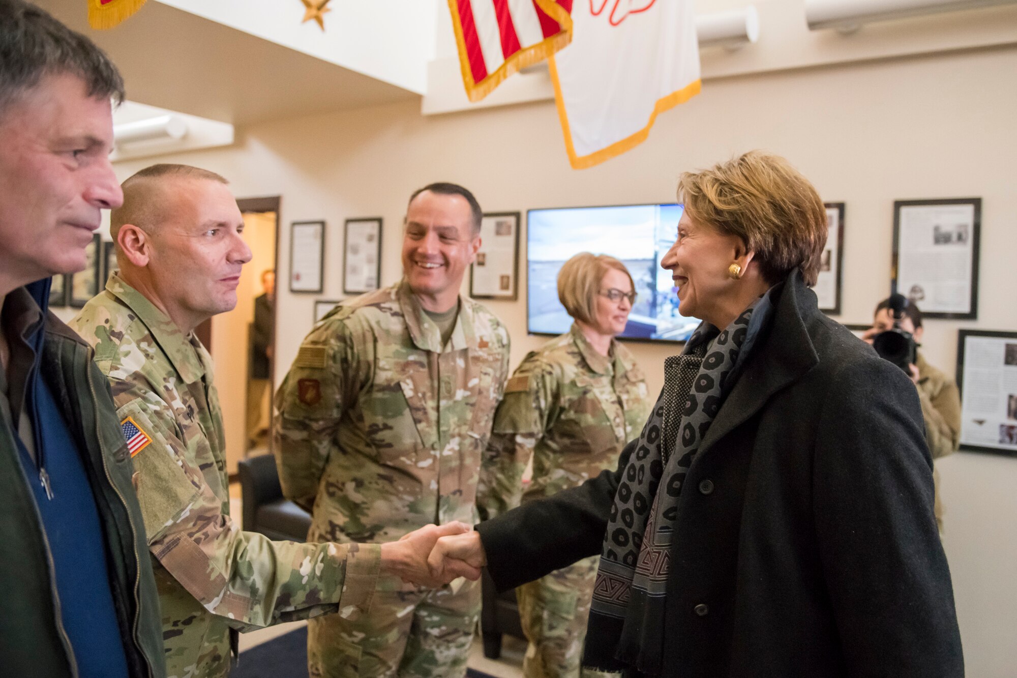 U.S. Army Maj. Gen. Gregory Porter, adjutant general, Wyoming National Guard, shakes hands with Secretary of the Air Force Barbara Barrett during a meet and greet at the 153d Airlift Wing, Wyoming Air National Guard Base, Cheyenne, Wyo., Oct. 27, 2019.